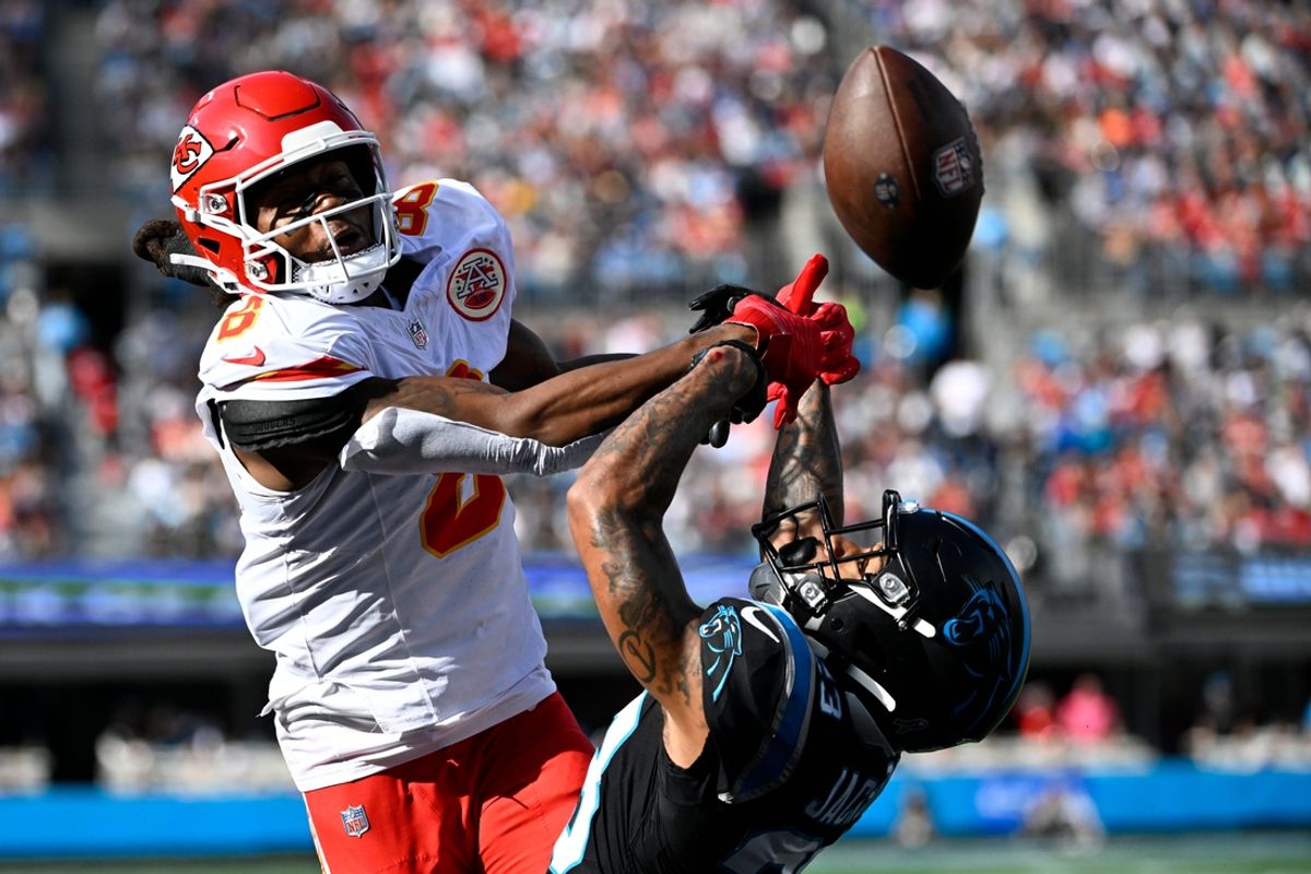 Nov 24, 2024; Charlotte, North Carolina, USA;  Carolina Panthers cornerback Dane Jackson (23) breaks up a pass in the end zone intended for Kansas City Chiefs wide receiver DeAndre Hopkins (8) in the second quarter at Bank of America Stadium. Mandatory Credit: Bob Donnan-Imagn Images
