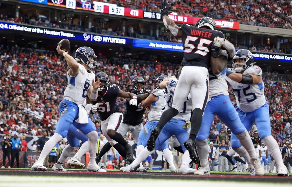 Nov 24, 2024; Houston, Texas, USA; Tennessee Titans quarterback Will Levis (8) drops back to pass against Houston Texans defensive end Will Anderson Jr. (51) in the fourth quarter at NRG Stadium. Mandatory Credit: Thomas Shea-Imagn Images