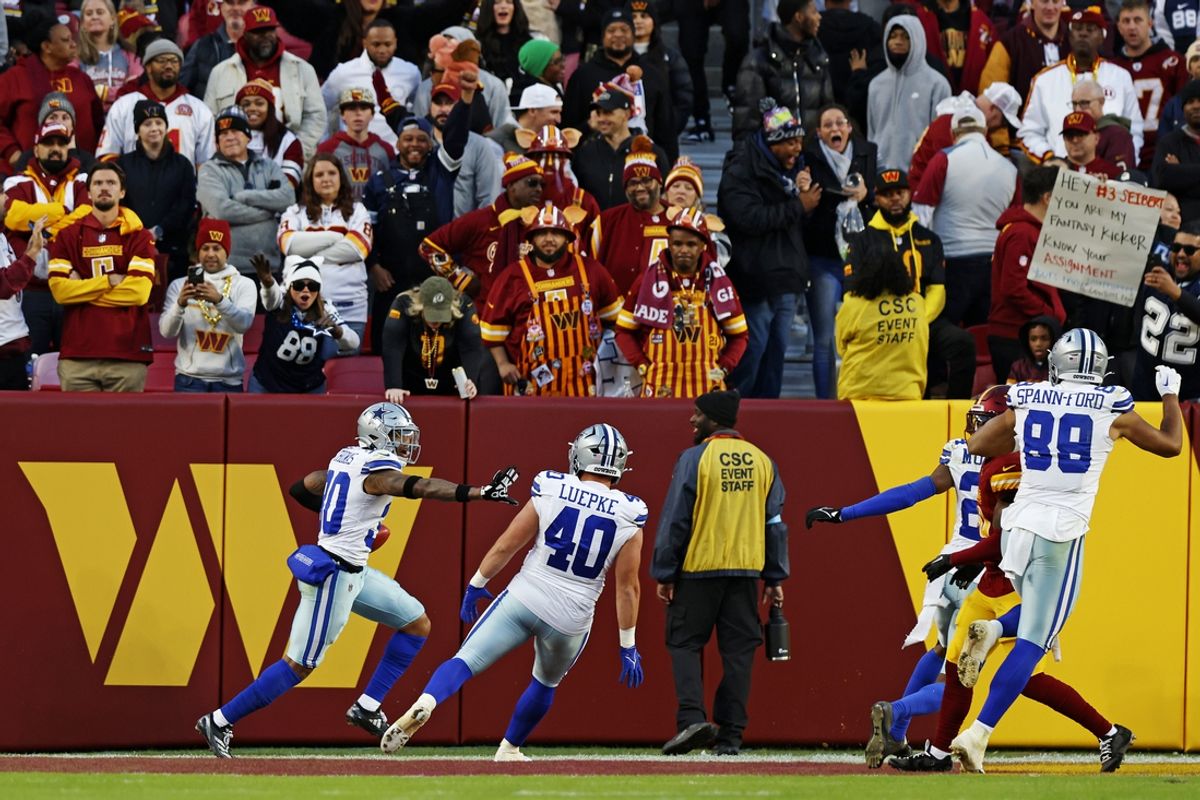 Nov 24, 2024; Landover, Maryland, USA; Dallas Cowboys safety Juanyeh Thomas (30) celebrates after scoring a touchdown on an onside kick return during the fourth quarter against the Washington Commanders at Northwest Stadium. Mandatory Credit: Peter Casey-Imagn Images