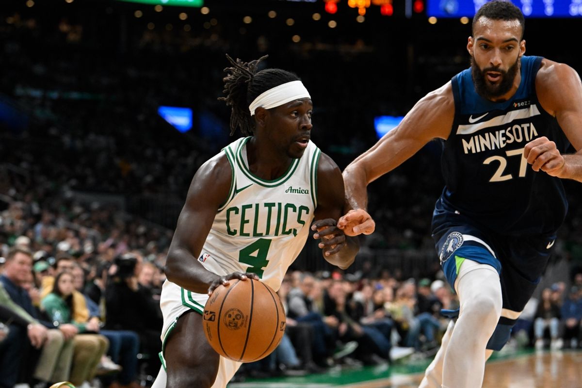 Nov 24, 2024; Boston, Massachusetts, USA; Boston Celtics guard Jrue Holiday (4) drives against Minnesota Timberwolves center Rudy Gobert (27) during the first half at TD Garden. Mandatory Credit: Eric Canha-Imagn Images