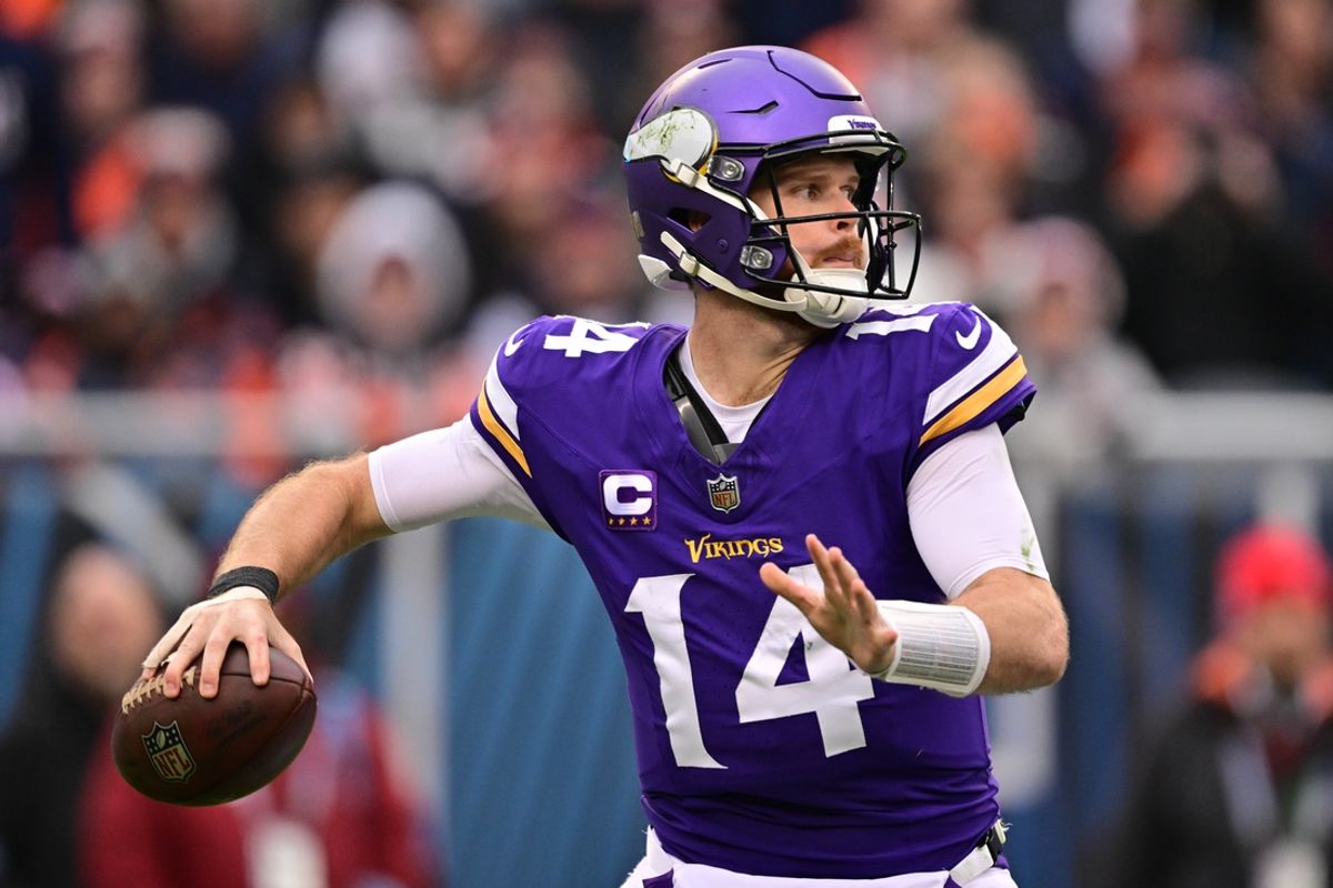 Nov 24, 2024; Chicago, Illinois, USA; Minnesota Vikings quarterback Sam Darnold (14) passes the ball against the Chicago Bears during the third quarter at Soldier Field. Mandatory Credit: Daniel Bartel-Imagn Images