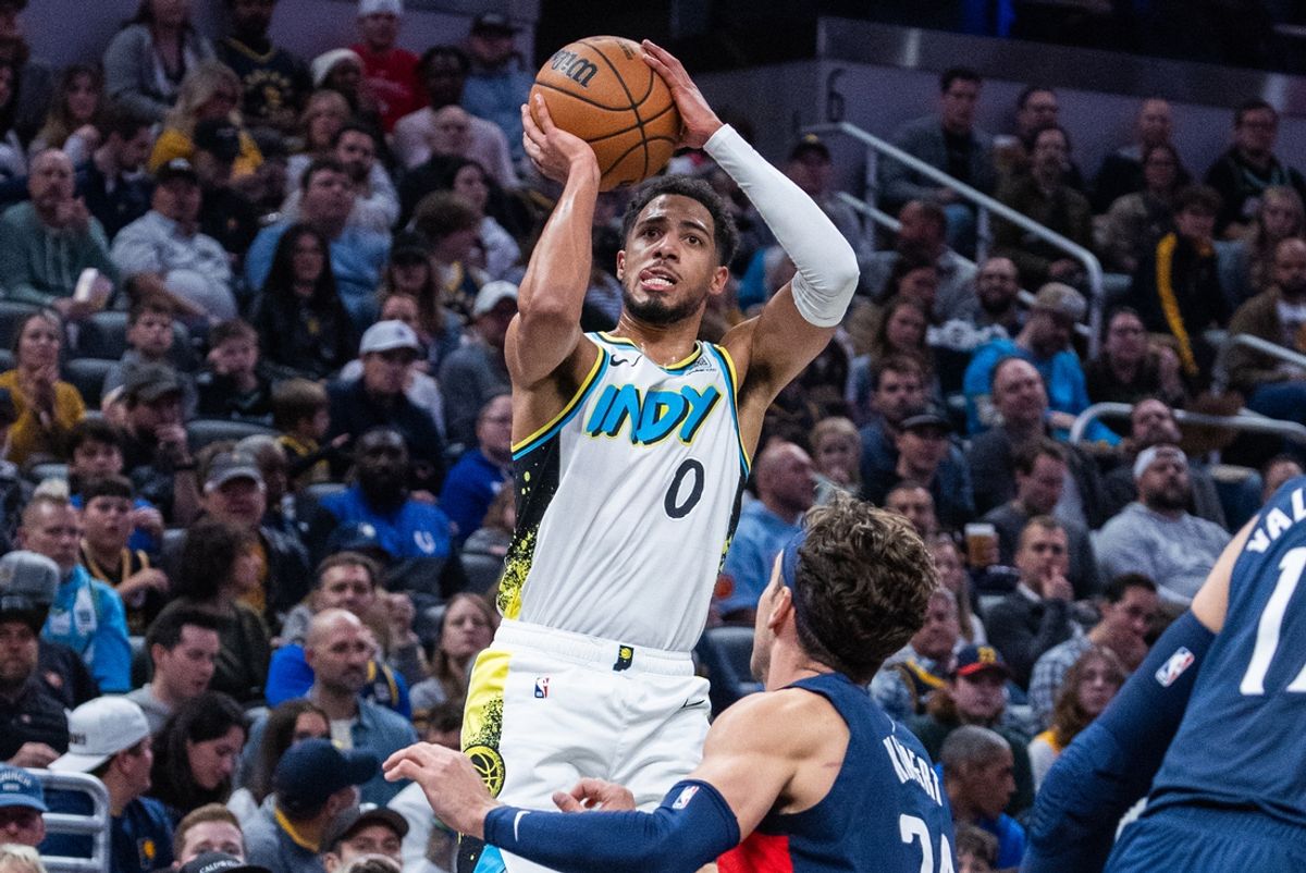 Nov 24, 2024; Indianapolis, Indiana, USA;  Indiana Pacers guard Tyrese Haliburton (0) shoots the ball while Washington Wizards forward Corey Kispert (24) defends in the first quarter at Gainbridge Fieldhouse. Mandatory Credit: Trevor Ruszkowski-Imagn Images