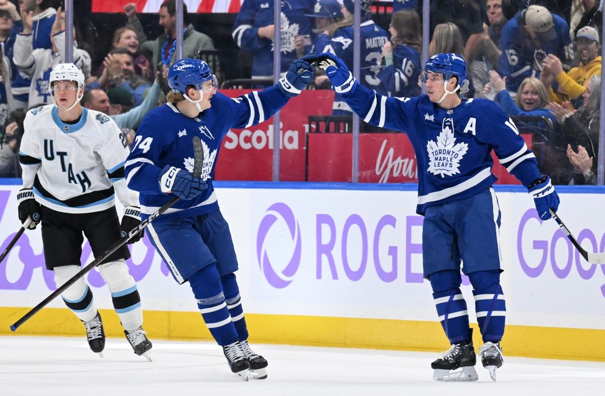 Nov 24, 2024; Toronto, Ontario, CAN;  Toronto Maple Leafs forward Mitch Marner (16) celebrates with forward Bobby McMann (74) after scoring a goal against the Utah Hockey Club in the second period at Scotiabank Arena. Mandatory Credit: Dan Hamilton-Imagn Images