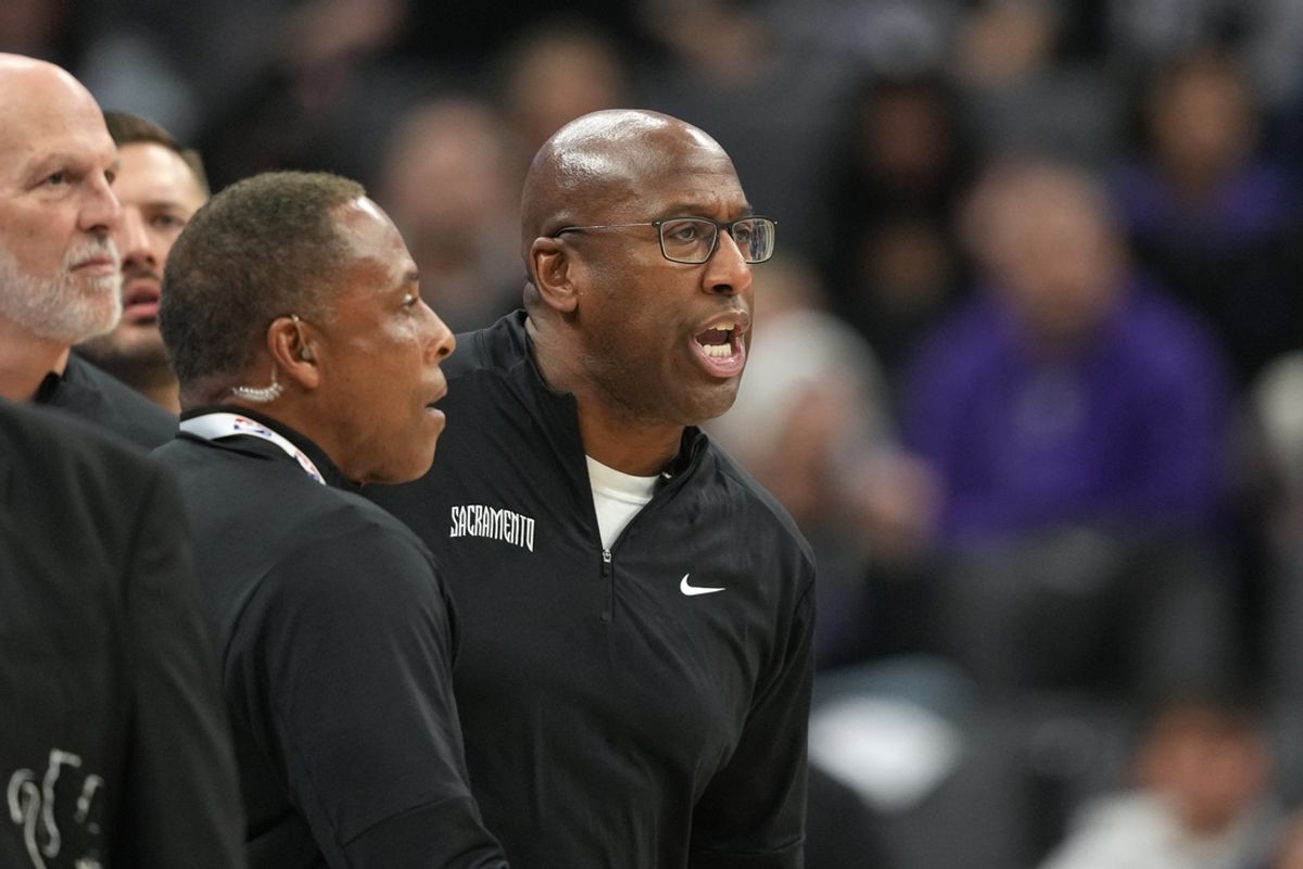 Nov 24, 2024; Sacramento, California, USA; Sacramento Kings head coach Mike Brown (center) yells after receiving a technical foul during the second quarter against the Brooklyn Nets at Golden 1 Center. Mandatory Credit: Darren Yamashita-Imagn Image