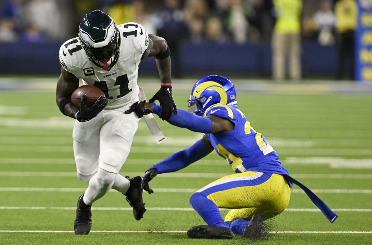 Nov 24, 2024; Inglewood, California, USA;  Philadelphia Eagles wide receiver A.J. Brown (11) spins away from Los Angeles Rams cornerback Darious Williams (24) after a catch-and-run during the first half at SoFi Stadium. Mandatory Credit: Alex Gallardo-Imagn Images