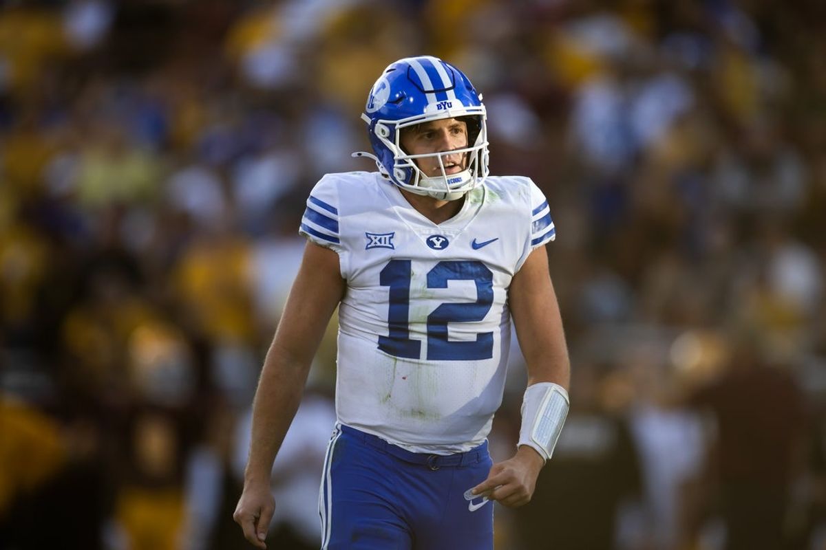 Nov 23, 2024; Tempe, Arizona, USA; Brigham Young Cougars quarterback Jake Retzlaff (12) against the Arizona State Sun Devils at Mountain America Stadium. Mandatory Credit: Mark J. Rebilas-Imagn Images