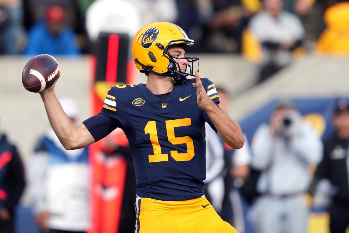 Nov 23, 2024; Berkeley, California, USA; California Golden Bears quarterback Fernando Mendoza (15) throws a pass against the Stanford Cardinal during the fourth quarter at California Memorial Stadium. Mandatory Credit: Darren Yamashita-Imagn Images