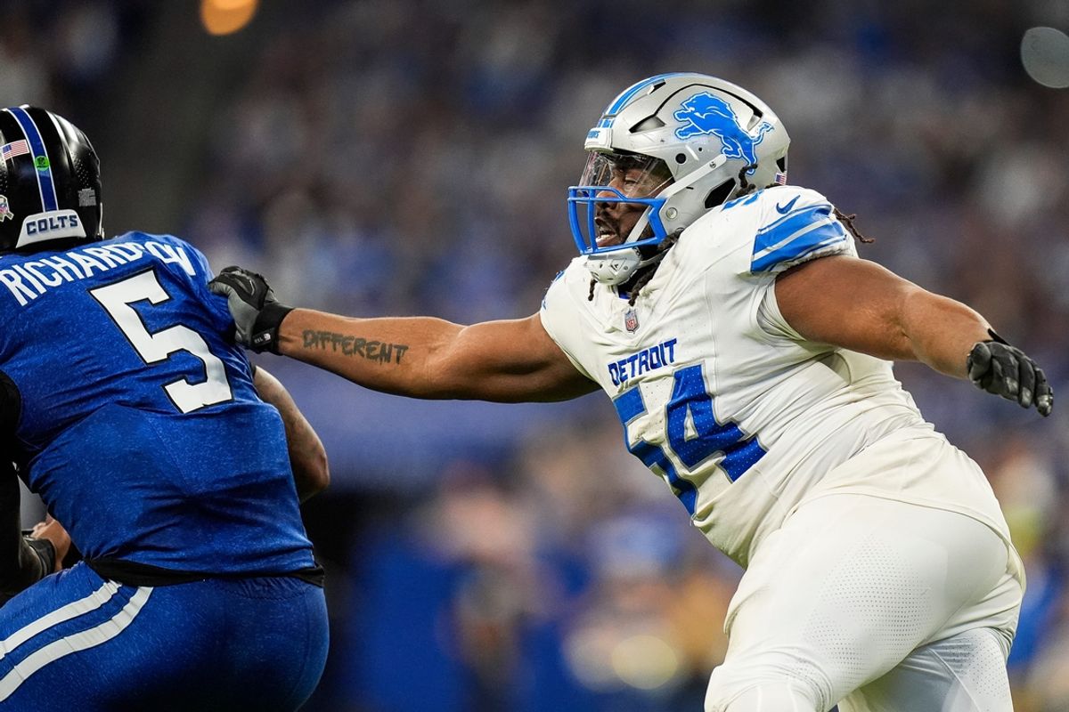 Detroit Lions defensive tackle Alim McNeill (54) stops Indianapolis Colts quarterback Anthony Richardson (5) during the second half at Lucas Oil Stadium in Indianapolis, Ind. on Sunday, Nov. 24, 2024.