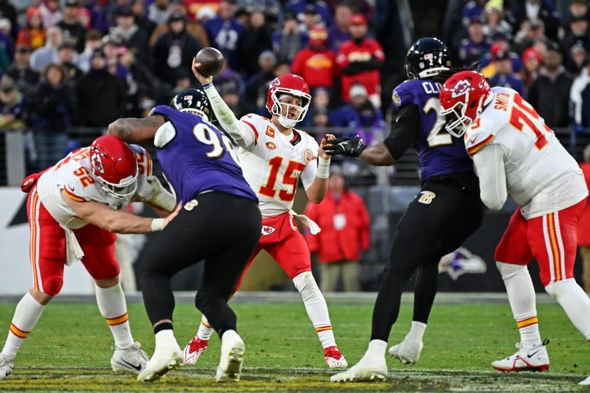 Jan 28, 2024; Baltimore, Maryland, USA; Kansas City Chiefs quarterback Patrick Mahomes (15) passes the ball against the Baltimore Ravens during the second half in the AFC Championship football game at M&T Bank Stadium.