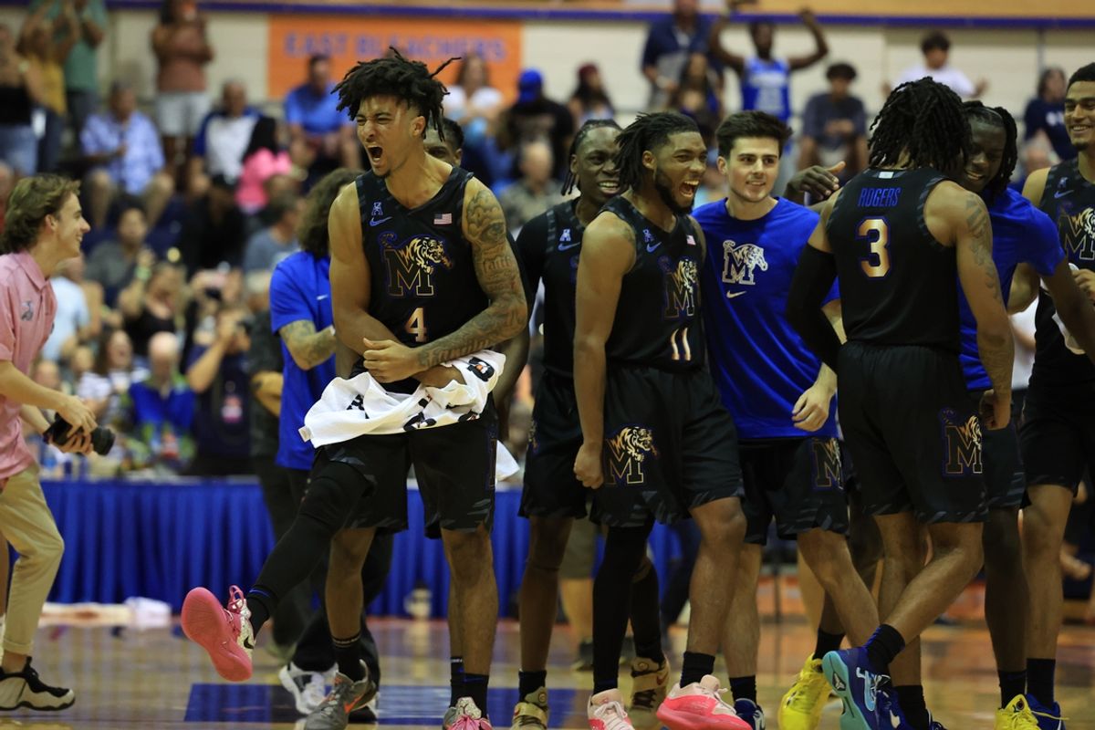 Nov 25, 2024; Lahaina, Hawaii, USA;  The Memphis Tigers react after defeating the Connecticut Huskies 99-97 in OT after an NCAA college basketball game at Lahaina Civic Center. Mandatory Credit: Marco Garcia-Imagn Images