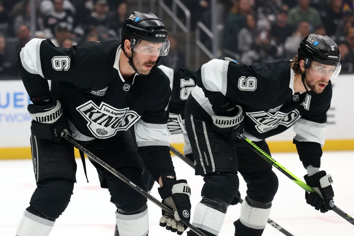 Nov 23, 2024; Los Angeles, California, USA;  Los Angeles Kings defenseman Joel Edmundson (6) and right wing Adrian Kempe (9) on the ice during the game against the Seattle Kraken at Crypto.com Arena. Mandatory Credit: Kiyoshi Mio-Imagn Images
