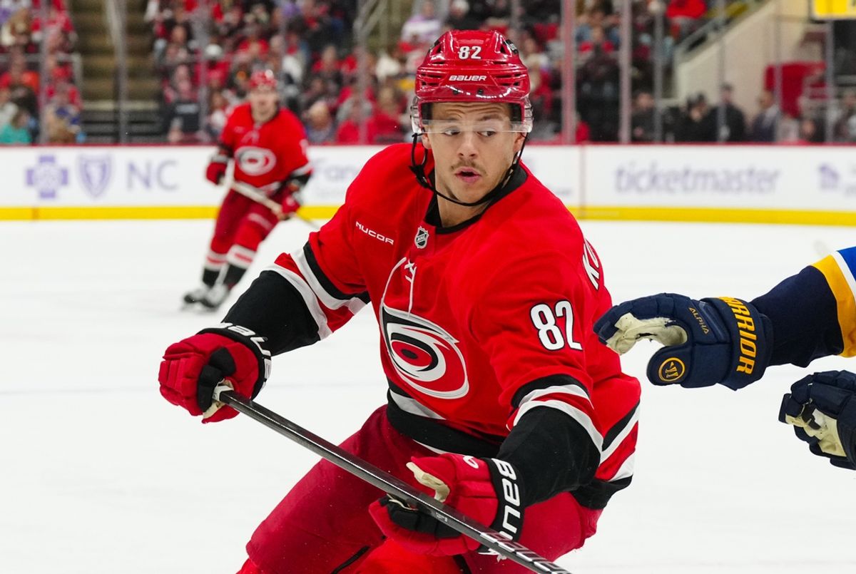 Nov 17, 2024; Raleigh, North Carolina, USA;  Carolina Hurricanes center Jesperi Kotkaniemi (82) skates against the St. Louis Blues during the third period at Lenovo Center. Mandatory Credit: James Guillory-Imagn Images