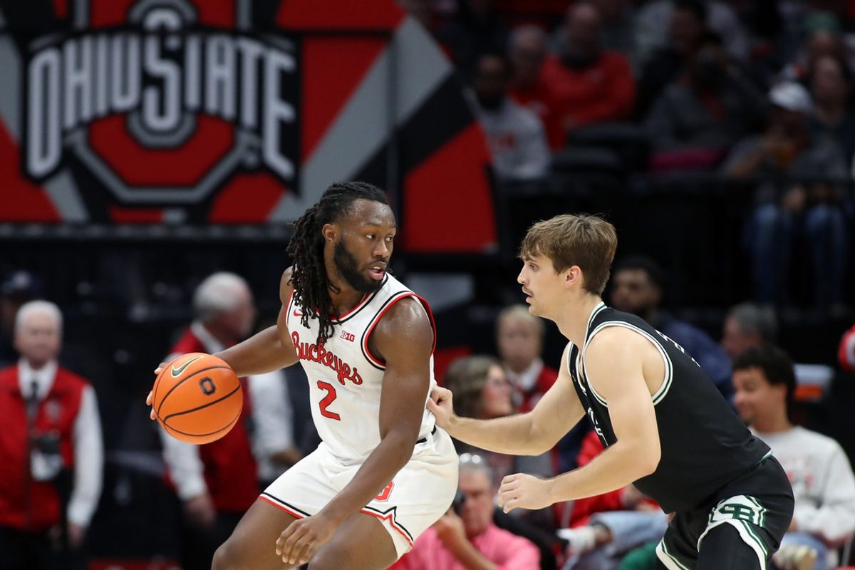Nov 25, 2024; Columbus, Ohio, USA;  Ohio State Buckeyes guard Bruce Thornton (2) dribbles the ball as Green Bay Phoenix guard Mac Wrecke (4) defends during the first half at Value City Arena. Mandatory Credit: Joseph Maiorana-Imagn Images