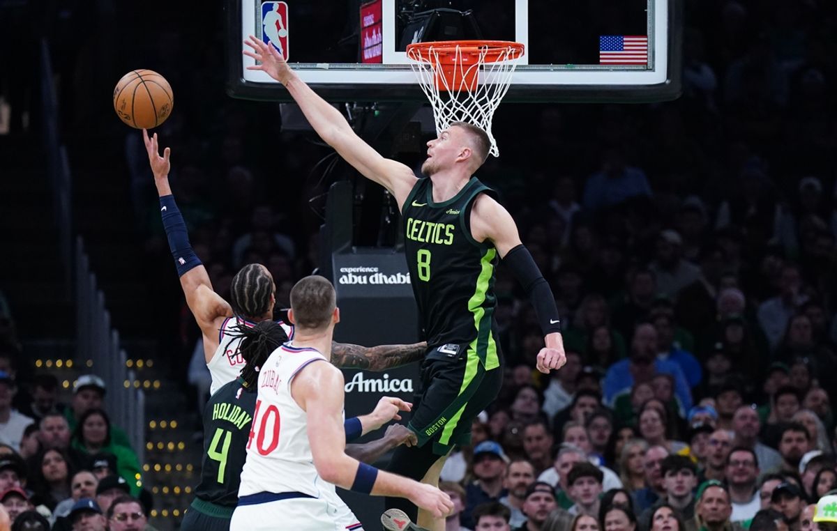 Nov 25, 2024; Boston, Massachusetts, USA; Boston Celtics center Kristaps Porzingis (8) defends against LA Clippers guard Amir Coffey (7) in the first quarter at TD Garden. Mandatory Credit: David Butler II-Imagn Images