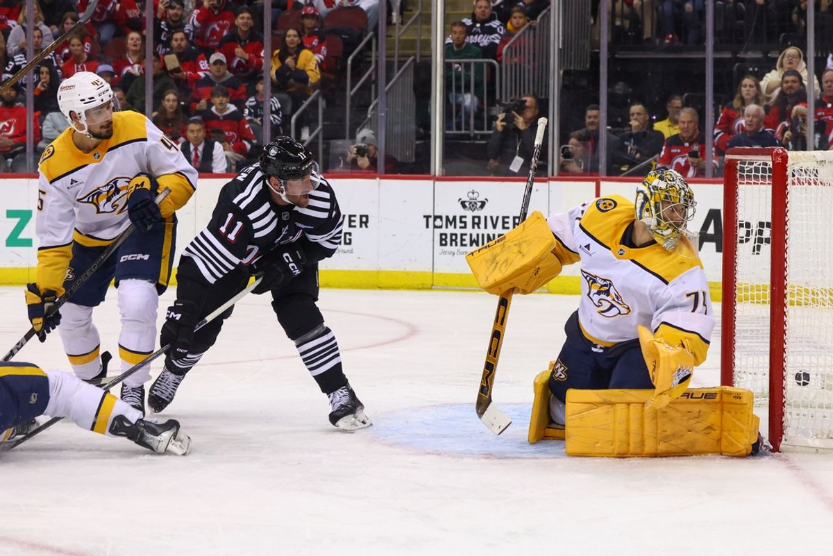 Nov 25, 2024; Newark, New Jersey, USA; New Jersey Devils center Nico Hischier (13) (not shown) scores a goal on Nashville Predators goaltender Juuse Saros (74) during the second period at Prudential Center. Mandatory Credit: Ed Mulholland-Imagn Images