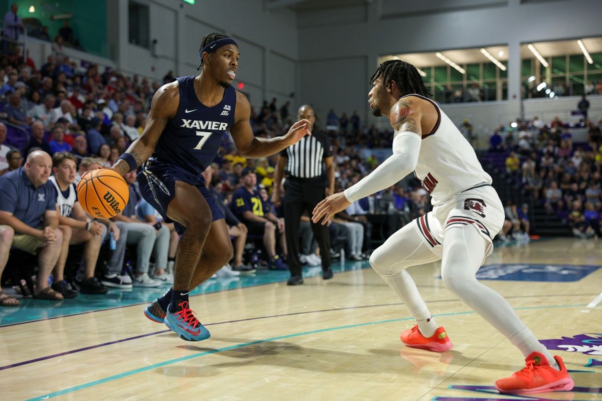 Nov 25, 2024; Fort Myers, Florida, USA; Xavier Musketeers guard Ryan Conwell (7) is guarded by South Carolina Gamecocks guard Jacobi Wright (1) in the first half at Suncoast Credit Union Arena. Mandatory Credit: Nathan Ray Seebeck-Imagn Images