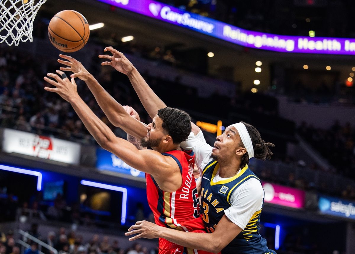 Nov 25, 2024; Indianapolis, Indiana, USA;  New Orleans Pelicans forward Jeremiah Robinson-Earl (50) and Indiana Pacers center Moses Brown (3) fight for a rebound in the second half at Gainbridge Fieldhouse. Mandatory Credit: Trevor Ruszkowski-Imagn Images