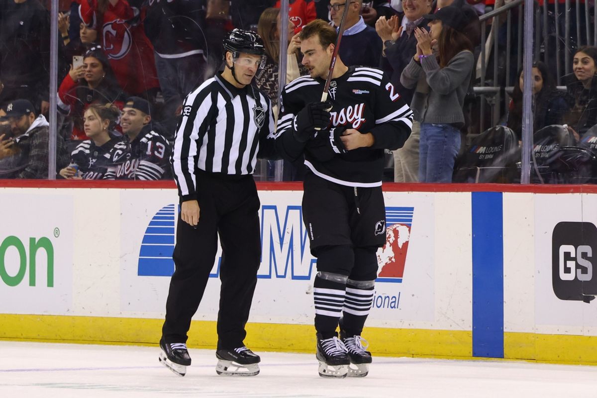 Nov 25, 2024; Newark, New Jersey, USA; New Jersey Devils right wing Timo Meier (28) is escorted off the ice after receiving a game misconduct penalty against the Nashville Predators during the third period at Prudential Center. Mandatory Credit: Ed Mulholland-Imagn Images