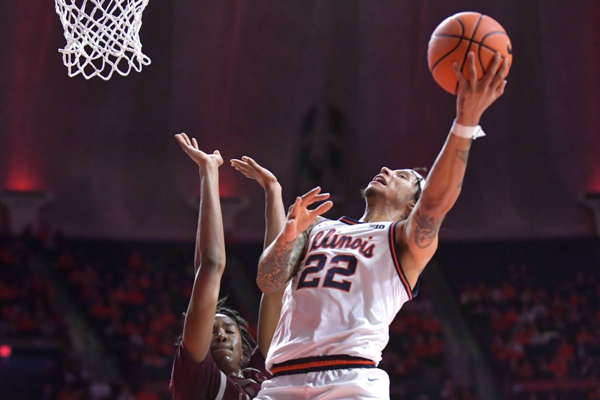Nov 25, 2024; Champaign, Illinois, USA;  Illinois Fighting Illini guard Tre White (22) drives to the basket during the first half against the Little Rock Trojans  at State Farm Center. Mandatory Credit: Ron Johnson-Imagn Images