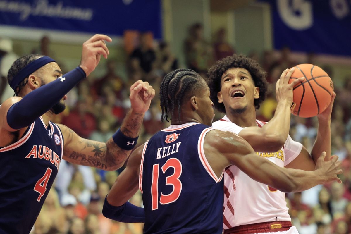 Nov 25, 2024; Lahaina, Hawaii, USA;  Auburn Tigers forward Johni Broome (4) and guard Miles Kelly (13) guard Iowa State Cyclones guard Curtis Jones (5) during the first half an NCAA college basketball game at Lahaina Civic Center. Mandatory Credit: Marco Garcia-Imagn Images