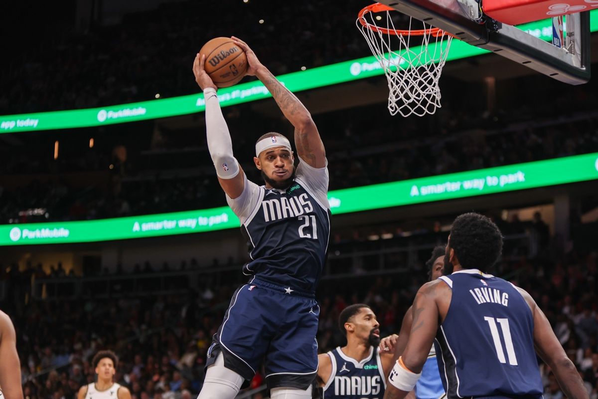 Nov 25, 2024; Atlanta, Georgia, USA; Dallas Mavericks center Daniel Gafford (21) grabs a rebound against the Atlanta Hawks in the third quarter at State Farm Arena. Mandatory Credit: Brett Davis-Imagn Images