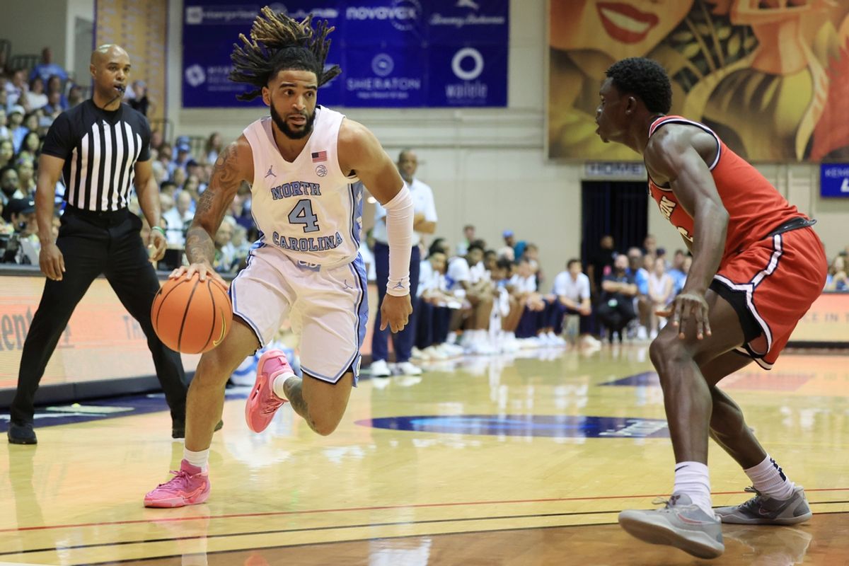 Nov 25, 2024; Lahaina, Hawaii, USA;  North Carolina Tar Heels guard RJ Davis (4) dribbles against Dayton Flyers guard Enoch Cheeks (6) during the first half of an NCAA college basketball game at Lahaina Civic Center. Mandatory Credit: Marco Garcia-Imagn Images