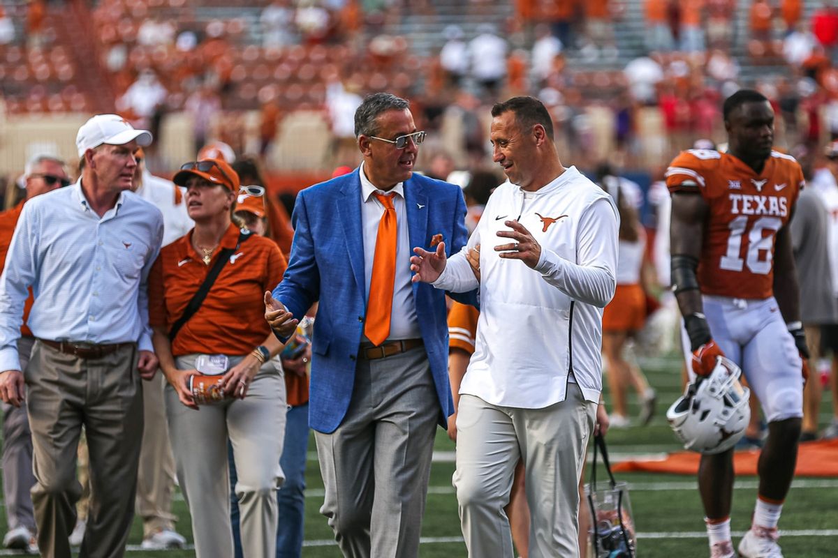 Texas athletic director Chris Del Conte, left, with football coach Steve Sarkisian, right.