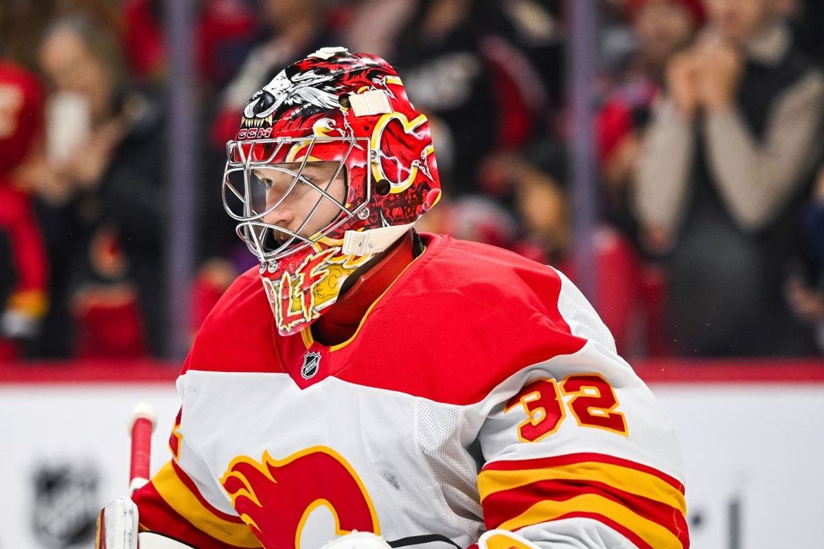Nov 25, 2024; Ottawa, Ontario, CAN; Calgary Flames goalie Dustin Wolf (32) looks on during warm-up before the game against the Ottawa Senators at Canadian Tire Centre. Mandatory Credit: David Kirouac-Imagn Images