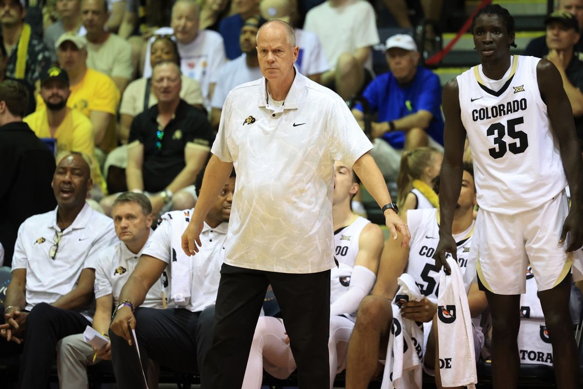 Nov 26, 2024; Lahaina, Hawaii, USA;  Colorado Buffaloes head coach Tad Boyle, left, watches his team take on the Connecticut Huskies during the first half of an NCAA college basketball game at Lahaina Civic Center. Mandatory Credit: Marco Garcia-Imagn Images