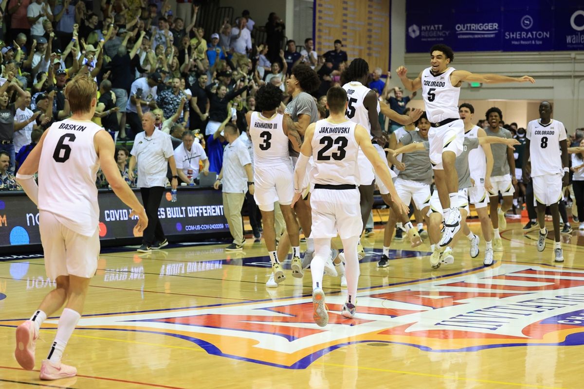 Nov 26, 2024; Lahaina, Hawaii, USA;  The Colorado Buffaloes rush the court after defeating the Connecticut Huskies in a NCAA college basketball game at Lahaina Civic Center. Mandatory Credit: Marco Garcia-Imagn Images