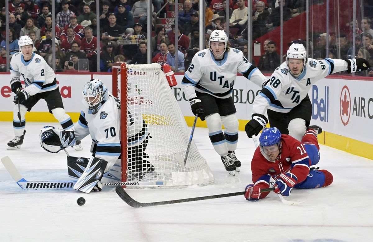 Nov 26, 2024; Montreal, Quebec, CAN; Montreal Canadiens forward Brendan Gallagher (11) shoots against Utah Hockey Club defenseman Mikhail Sergachev (98) and goalie Karel Vejmelka (70) during the first period at the Bell Centre. Mandatory Credit: Eric Bolte-Imagn Images