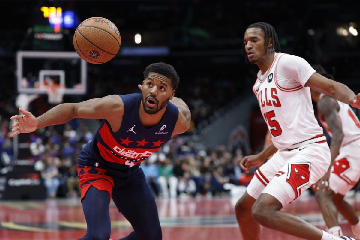Nov 26, 2024; Washington, District of Columbia, USA; Washington Wizards guard Jared Butler (4) loses th ball in front of Chicago Bulls forward Dalen Terry (25) in the second quarter at Capital One Arena. Mandatory Credit: Geoff Burke-Imagn Images