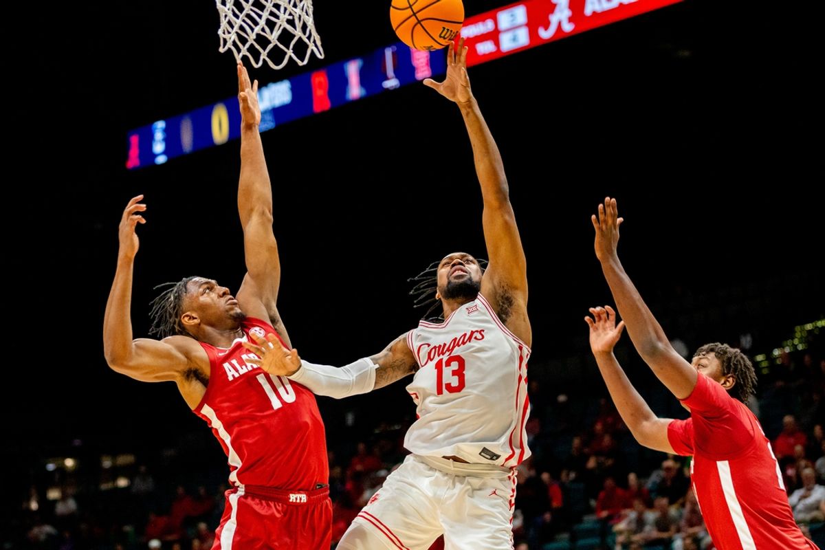 Nov 26, 2024; Las Vegas, Nevada, USA; Houston Cougar forward J'Wan Roberts (13) shoots the ball against Alabama Crimson Tide forward Mouhamed Dioubate (10) during the first half at MGM Grand Garden Arena. Mandatory Credit: Jeffrey (Tyge) O'Donnell-Imagn Images