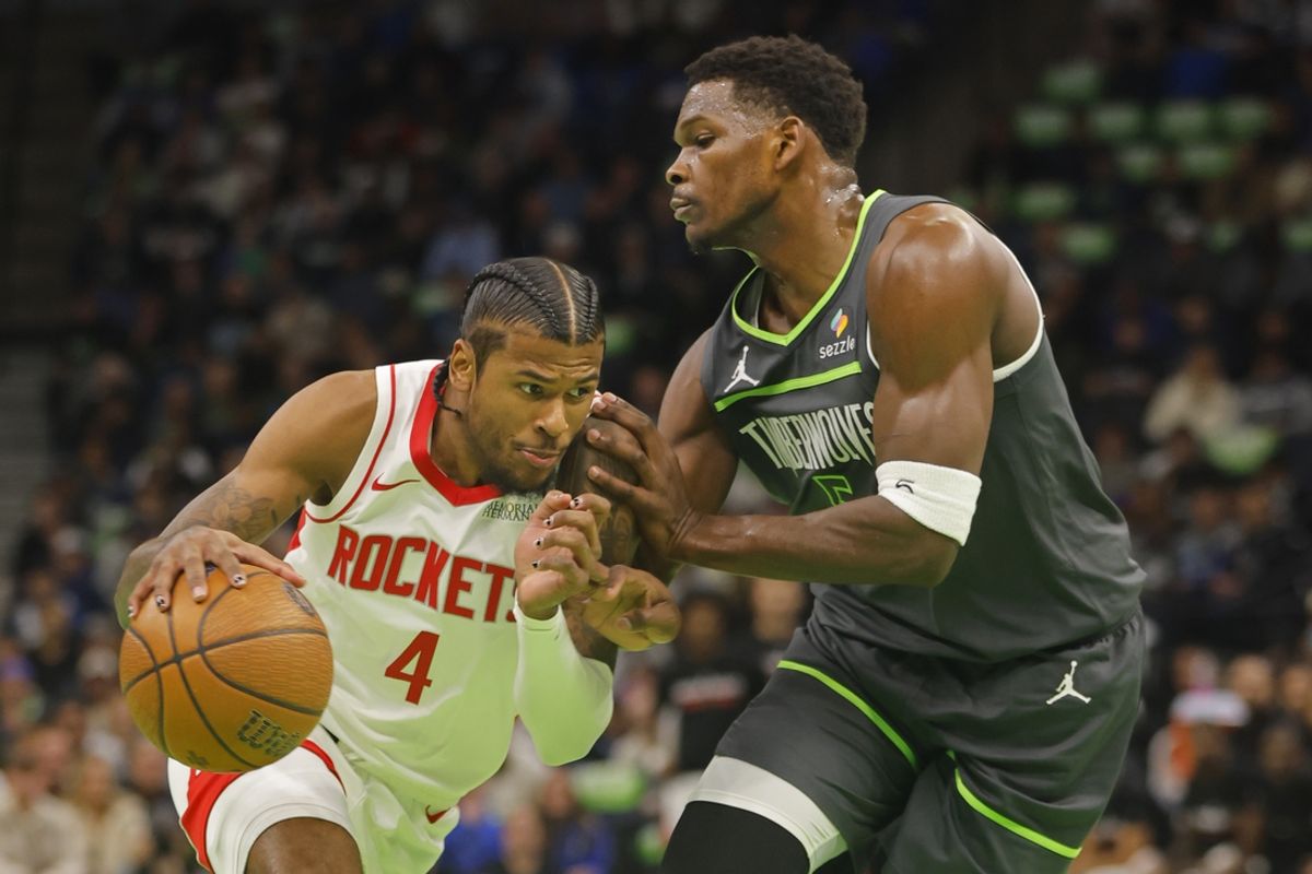 Nov 26, 2024; Minneapolis, Minnesota, USA; Houston Rockets guard Jalen Green (4) drives against Minnesota Timberwolves guard Anthony Edwards (5) in the first quarter at Target Center. Mandatory Credit: Bruce Kluckhohn-Imagn Images