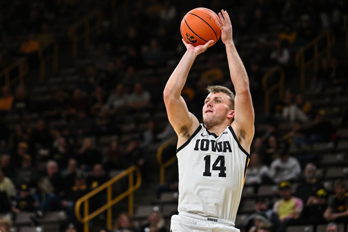 Nov 26, 2024; Iowa City, Iowa, USA; Iowa Hawkeyes guard Carter Kingsbury (14) shoots the ball against the USC Upstate Spartans during the second half at Carver-Hawkeye Arena. Mandatory Credit: Jeffrey Becker-Imagn Images