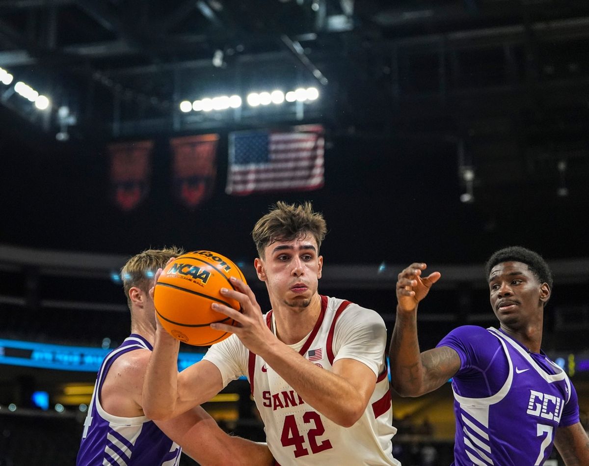 Stanford forward Maxime Raynaud (42) grabs a rebound in competition with Grand Canyon forward Duke Brennan (left) and Grand Canyon guard Tyon Grant-Foster (7) during the second half of their game in the Acrisure Series in Palm Desert, Calif., Tuesday, Nov. 26, 2024.