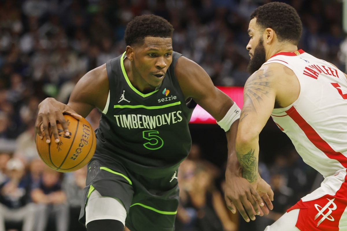 Nov 26, 2024; Minneapolis, Minnesota, USA; Minnesota Timberwolves guard Anthony Edwards (5) dribbles against Houston Rockets guard Fred VanVleet (5) in the fourth quarter at Target Center. Mandatory Credit: Bruce Kluckhohn-Imagn Images