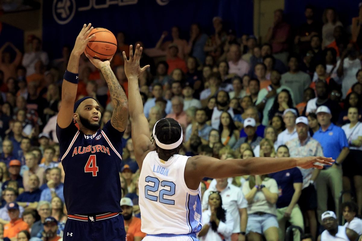 Nov 26, 2024; Lahaina, Hawaii, USA;  Auburn Tigers forward Johni Broome (4) shoots over North Carolina Tar Heels forward Ven-Allen Lubin (22) during the first half at Lahaina Civic Center. Mandatory Credit: Marco Garcia-Imagn Images