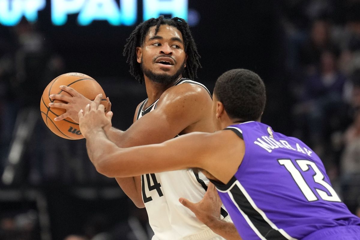 Nov 24, 2024; Sacramento, California, USA; Brooklyn Nets guard Cam Thomas (left) handles the ball against Sacramento Kings forward Keegan Murray (13) during the first quarter at Golden 1 Center. Mandatory Credit: Darren Yamashita-Imagn Images