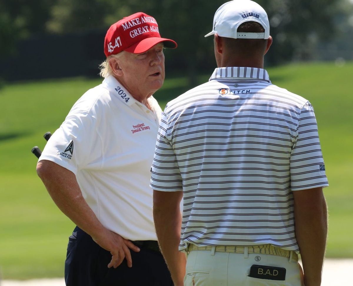 Bedminster, NJ August 9, 2023 -- President Donald Trump on the driving range as he played at Trump National in Bedminster before the weekend’s LIV Golf Tournament.