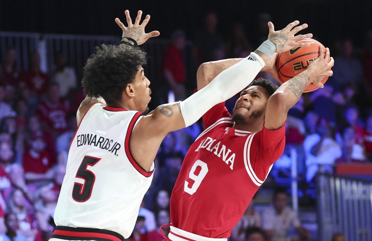 Nov 27, 2024; Paradise Island, Bahamas, BHS; Indiana Hoosiers guard Kanaan Carlyle (9) shoots as Louisville Cardinals guard Terrence Edwards Jr. (5) defends during the second half at the Atlantis Resort.  Mandatory Credit: Kevin Jairaj-Imagn Images
