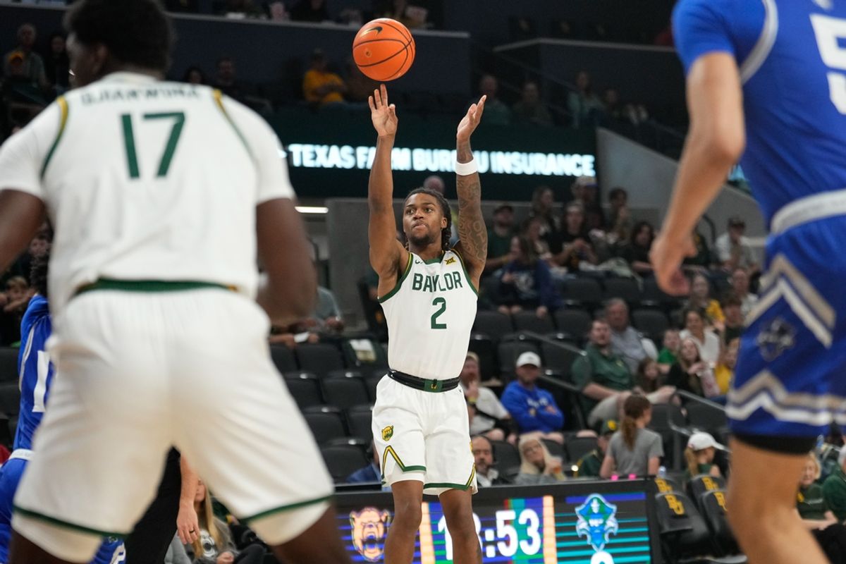 Nov 27, 2024; Waco, Texas, USA;  Baylor Bears guard Jayden Nunn (2) scores a three-point basket against the New Orleans Privateers during the first half at Paul and Alejandra Foster Pavilion. Mandatory Credit: Chris Jones-Imagn Images