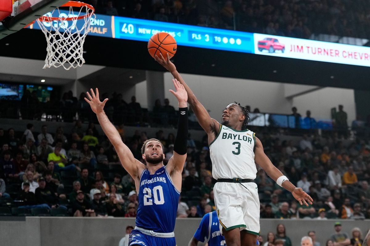 Nov 27, 2024; Waco, Texas, USA;  Baylor Bears guard Jeremy Roach (3) shoots against New Orleans Privateers forward Luke Davis (20) during the second half at Paul and Alejandra Foster Pavilion. Mandatory Credit: Chris Jones-Imagn Images