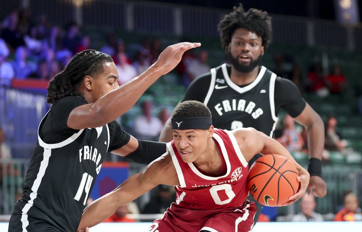 Nov 27, 2024; Paradise Island, Bahamas, BHS; Oklahoma Sooners guard Jeremiah Fears (0) dribbles as Providence Friars guard Corey Floyd Jr. (14) defends during the first half at the Atlantis Resort.  Mandatory Credit: Kevin Jairaj-Imagn Images