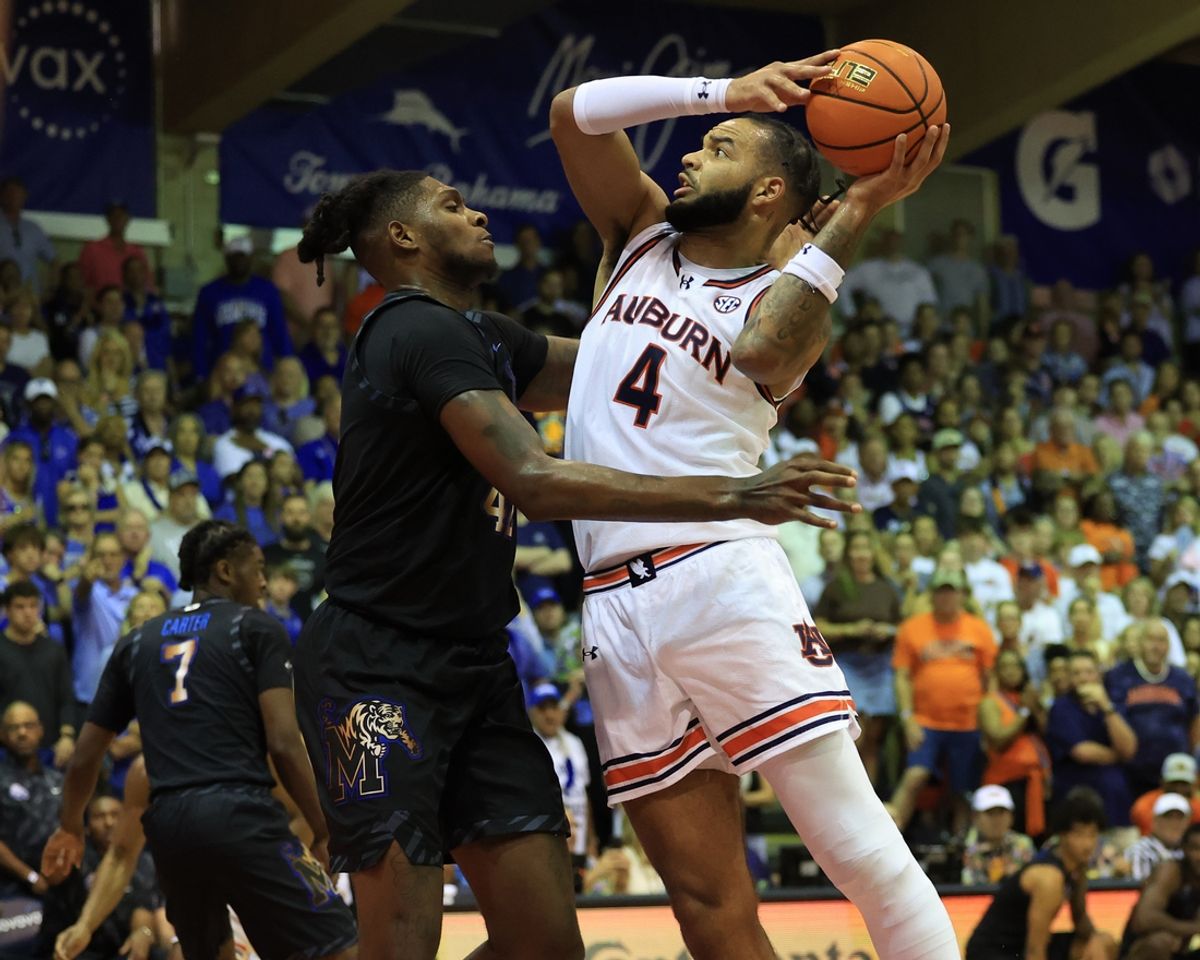 Nov 27, 2024; Lahaina, Hawaii, USA;  Auburn Tigers forward Johni Broome (4) shoots over Memphis Tigers forward Dain Dainja (42) in the first half at Lahaina Civic Center. Mandatory Credit: Marco Garcia-Imagn Images