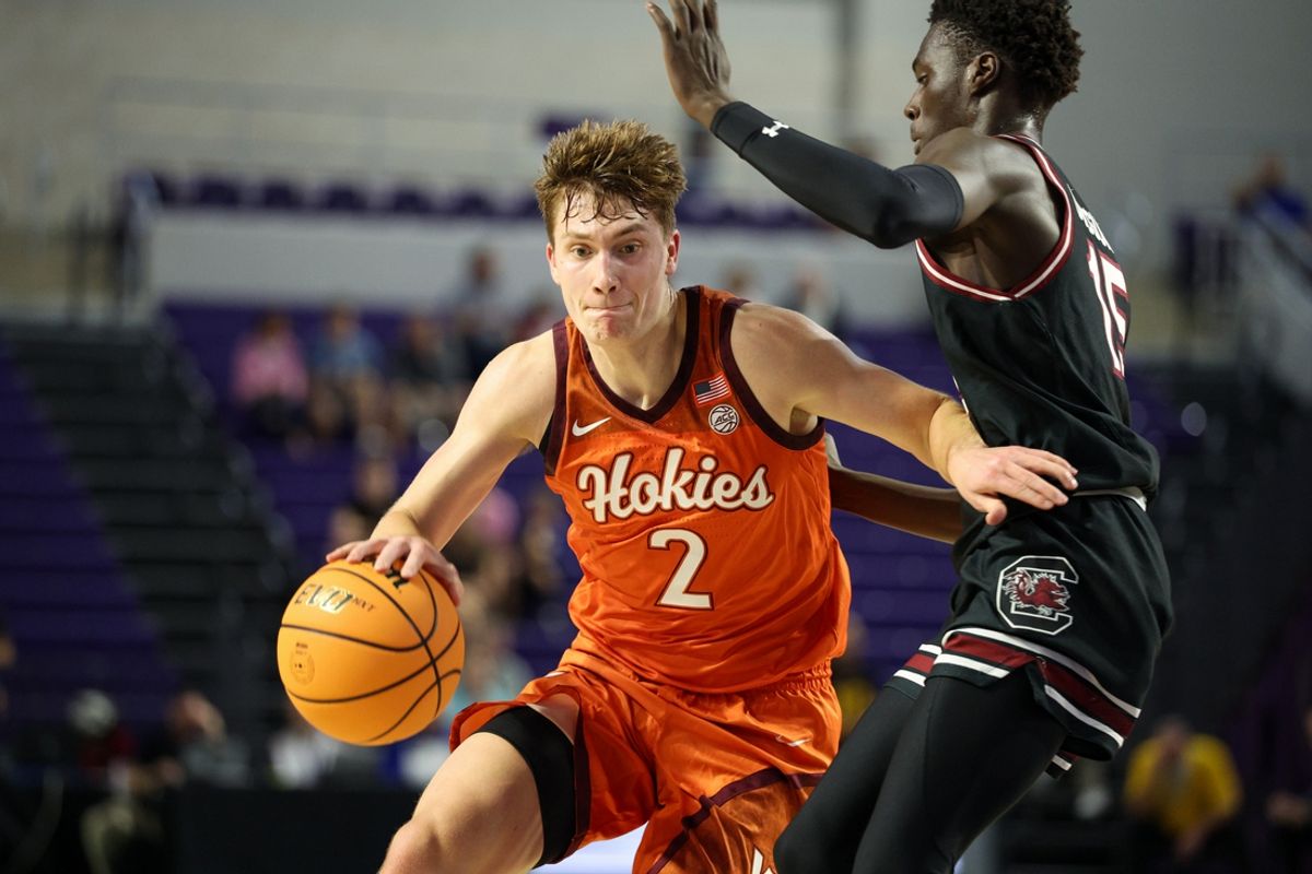 Nov 27, 2024; Fort Myers, Florida, USA; Virginia Tech Hokies guard Jaden Schutt (2) drives to the basket past South Carolina Gamecocks guard Morris Ugusuk (15) in the first half at Suncoast Credit Union Arena. Mandatory Credit: Nathan Ray Seebeck-Imagn Images