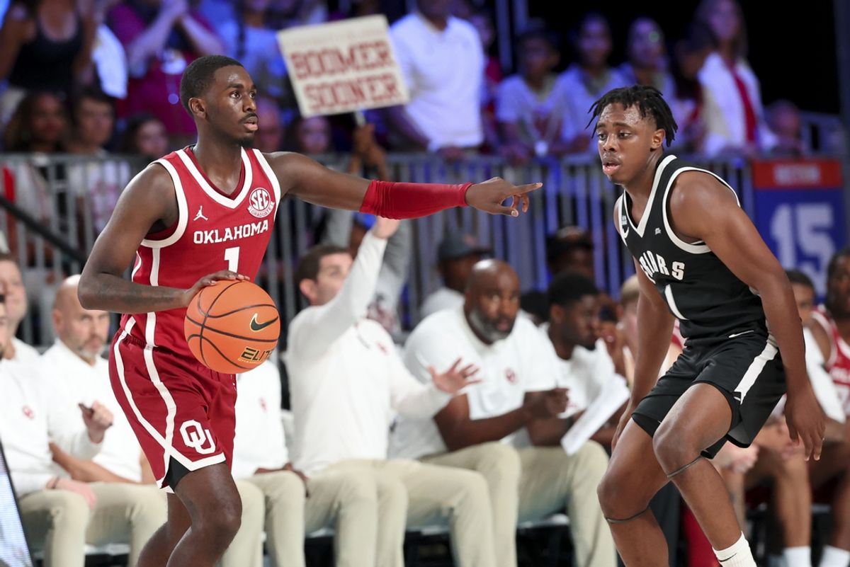 Nov 27, 2024; Paradise Island, Bahamas, BHS; Oklahoma Sooners guard Kobe Elvis (1) points as Providence Friars guard Jayden Pierre (1) defends during the second half at the Atlantis Resort.  Mandatory Credit: Kevin Jairaj-Imagn Images
