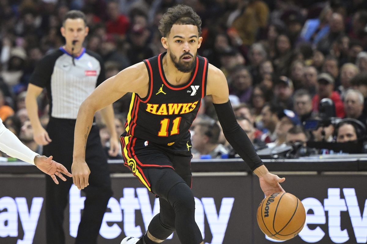 Nov 27, 2024; Cleveland, Ohio, USA; Atlanta Hawks guard Trae Young (11) dribbles the ball in the first quarter against the Cleveland Cavaliers at Rocket Mortgage FieldHouse. Mandatory Credit: David Richard-Imagn Images