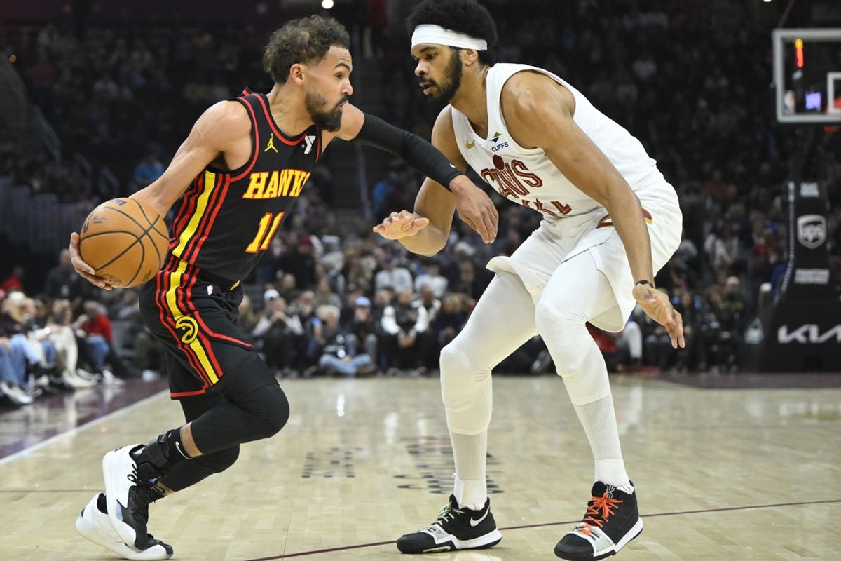 Nov 27, 2024; Cleveland, Ohio, USA; Cleveland Cavaliers center Jarrett Allen (31) defends Atlanta Hawks guard Trae Young (11) in the first quarter at Rocket Mortgage FieldHouse. Mandatory Credit: David Richard-Imagn Images