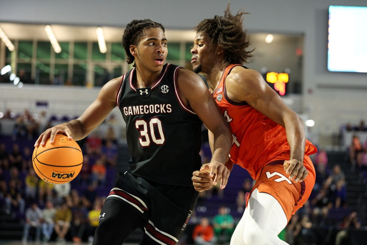 Nov 27, 2024; Fort Myers, Florida, USA; South Carolina Gamecocks forward Collin Murray-Boyles (30) is lauded by Virginia Tech Hokies forward Mylyjael Poteat (34) in the second half at Suncoast Credit Union Arena. Mandatory Credit: Nathan Ray Seebeck-Imagn Images